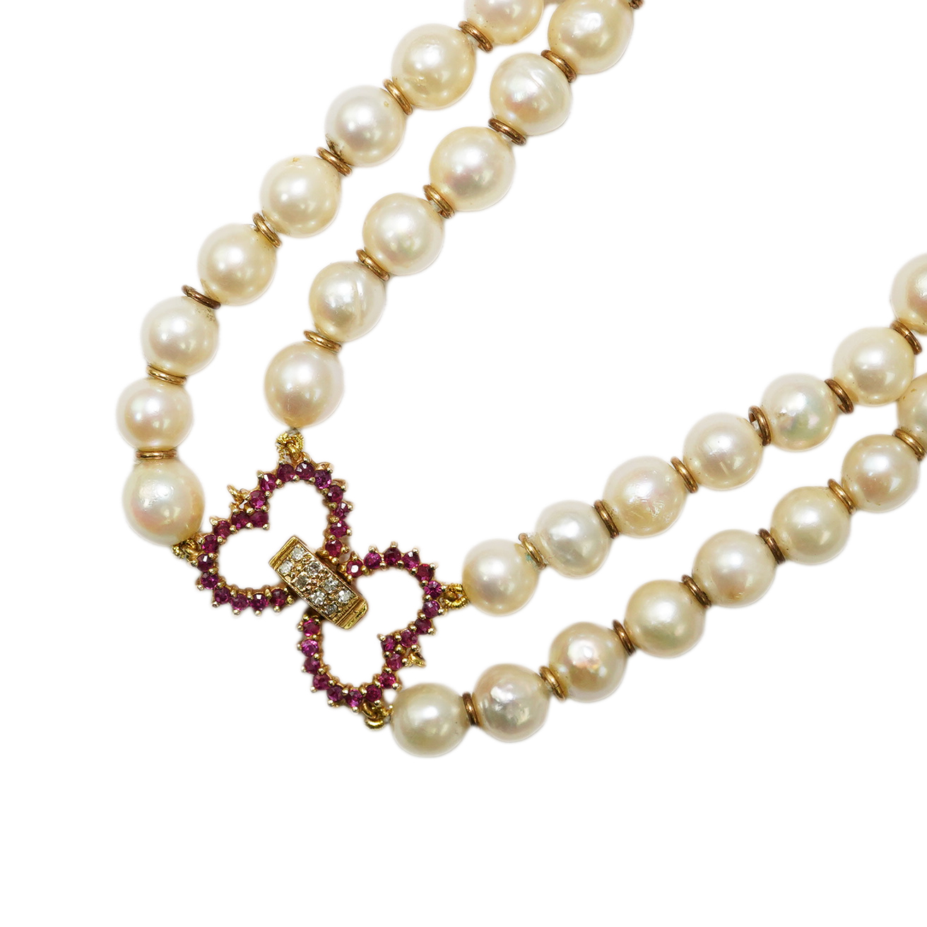 A double strand cultured pearl necklace, with ruby and diamond cluster set 9ct gold twin heart clasp, 57cm.